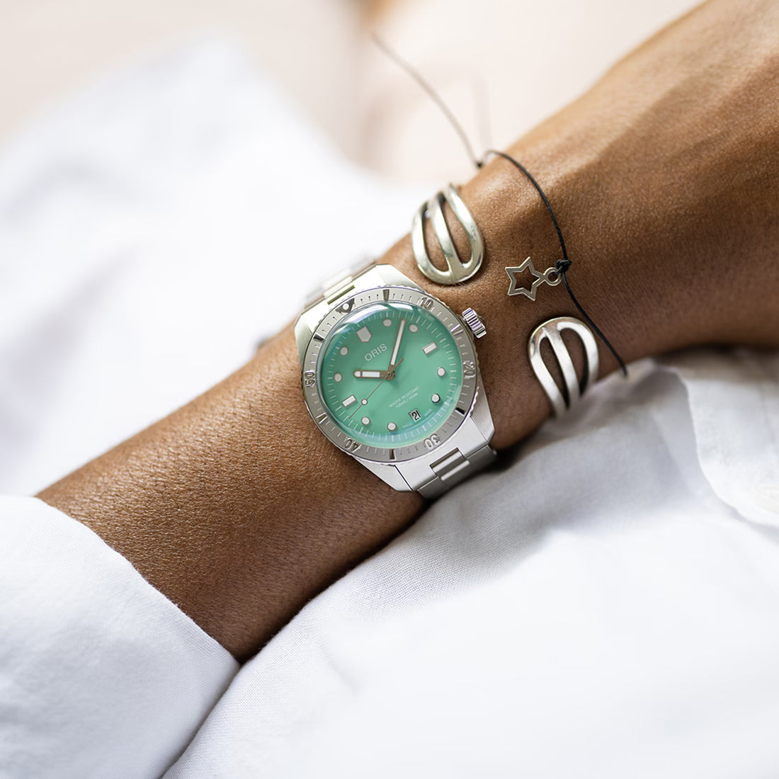 Oris Divers Sixty-Five Horloge 38mm met mintgroene wijzerplaat en roestvrijstalen band. Unisex Swiss Made horloge, perfect voor dames en heren.